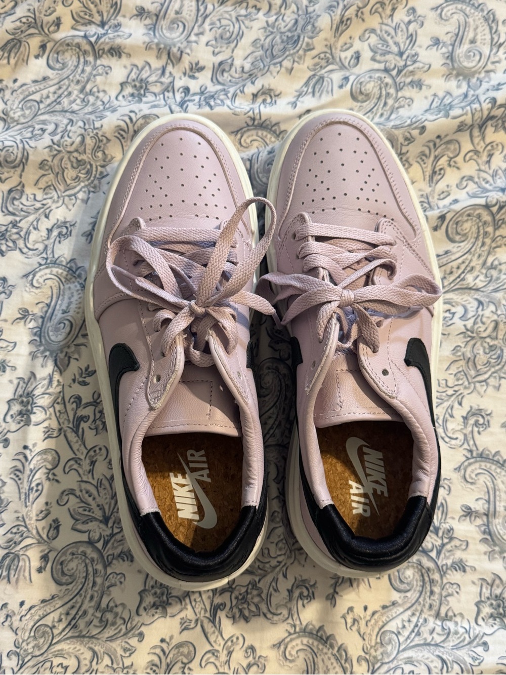 Nike Low Top Sneakers in Light Purple with Black Swoosh Detailing